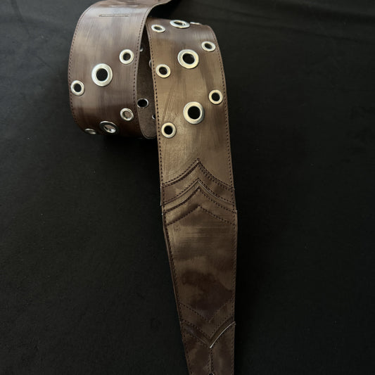 Aged strap metal eyelets
